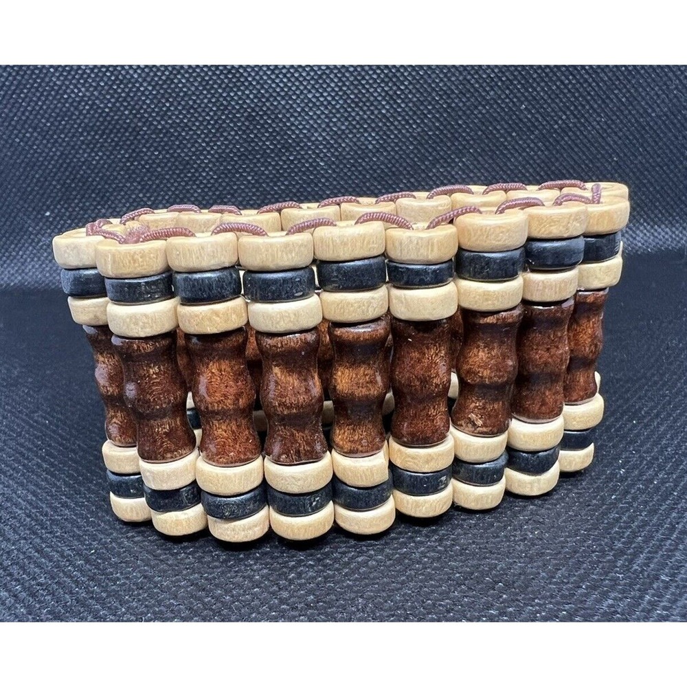 Wide wood stretch bracelet with a mix of brown and light brown wood beads